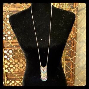 Long costume necklace for day and night.